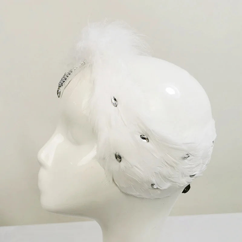 The Ottilie Swan Lake Headpiece crystal feather