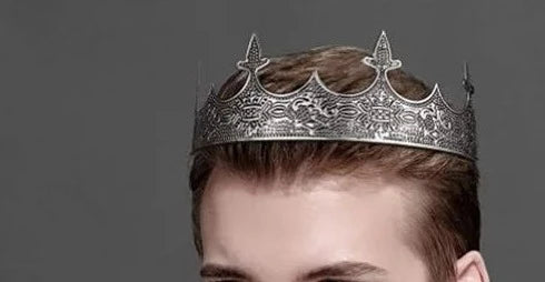 man wearing an antique silver kings crown