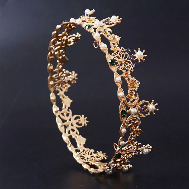 gold crown with faux emeralds pearls and crystal