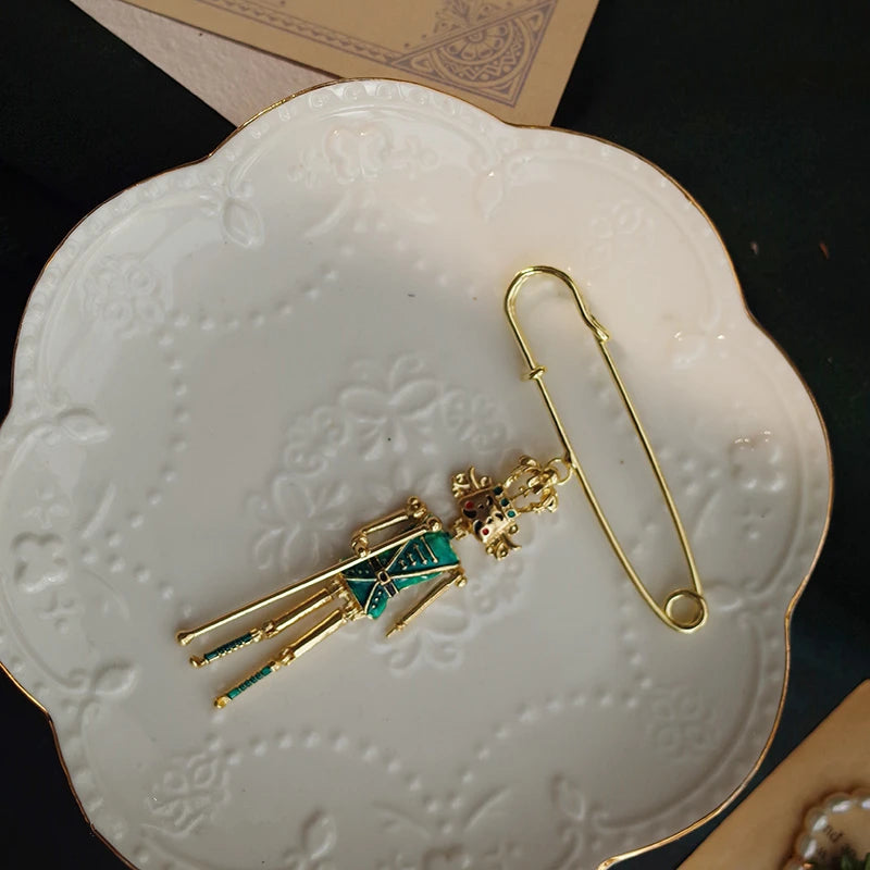 Little Gold Nutcracker Safety Pin - Stylish Ballet-inspired Accessory - Panache Ballet Boutique