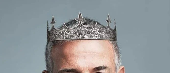 man wearing anqitue silver king's crown