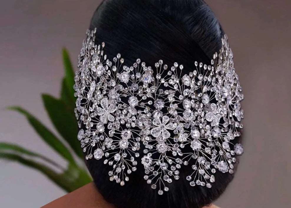 woman wearing a crystal bridal and ballerina headpiece with crystal flowers