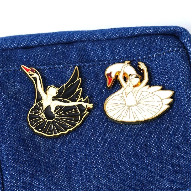 White and black ballerina swan pins on denim