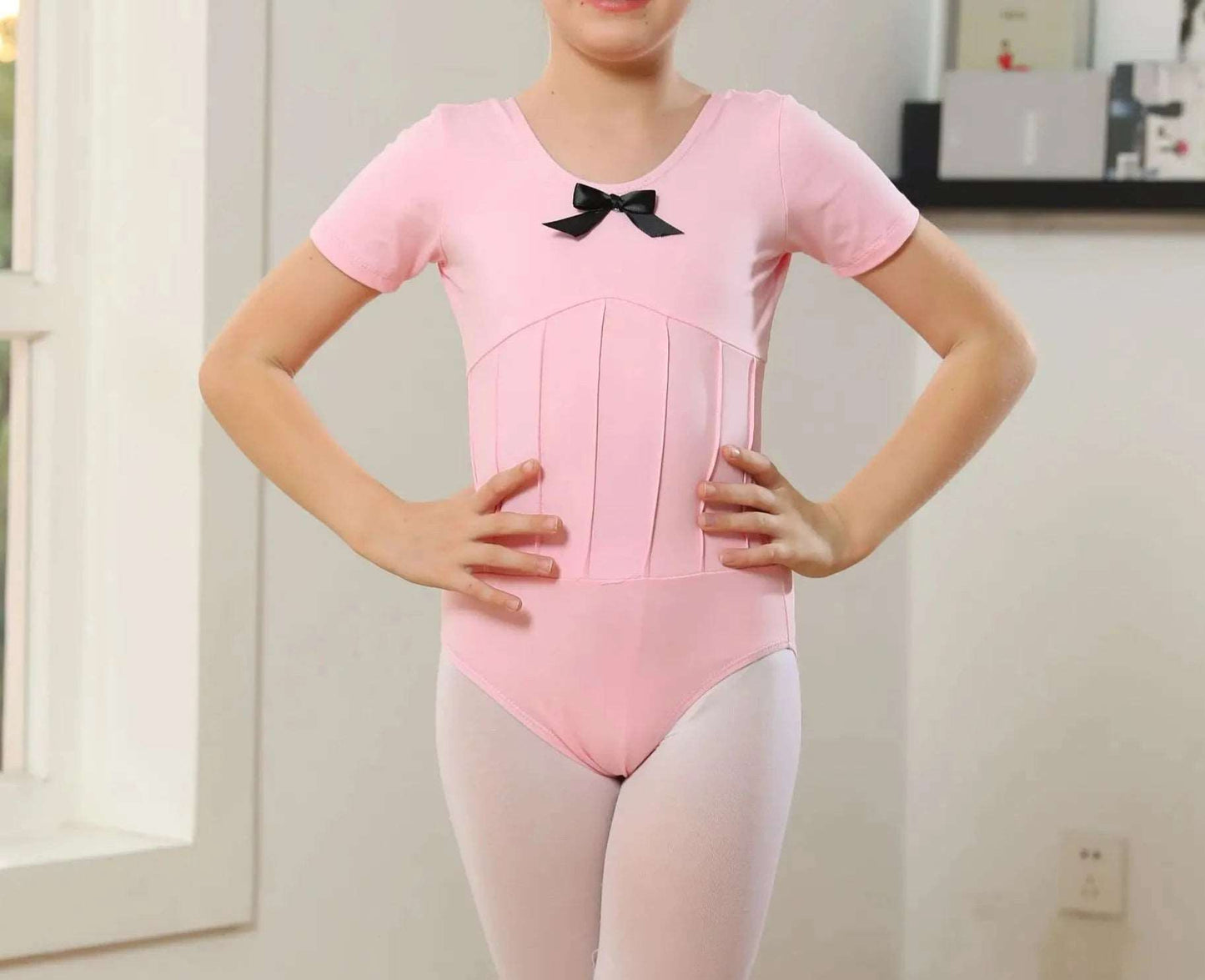 The Ari Leotard pink short sleeve leotard