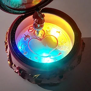 Round pink ballerina music box