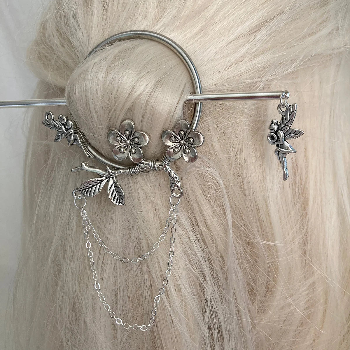 metal stick pin bun holder with flowers and fairies