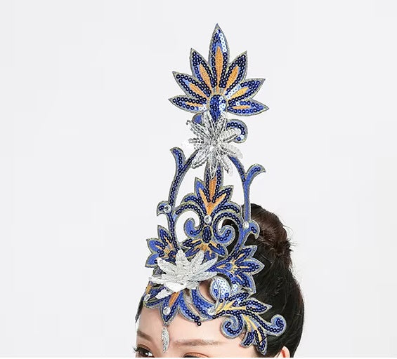front of woman wearing a silver sequined ballet headpiece