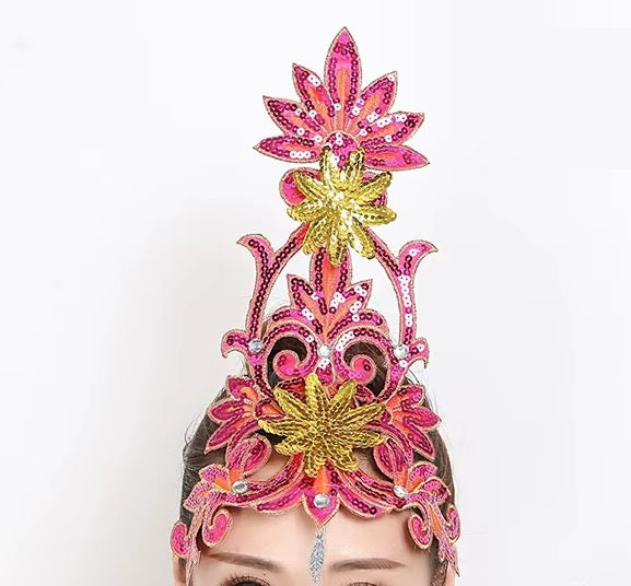 front of woman wearing a silver sequined ballet headpiece