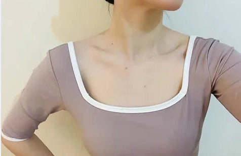 The Nour Leotard 3/4 sleeve leotard with white trim