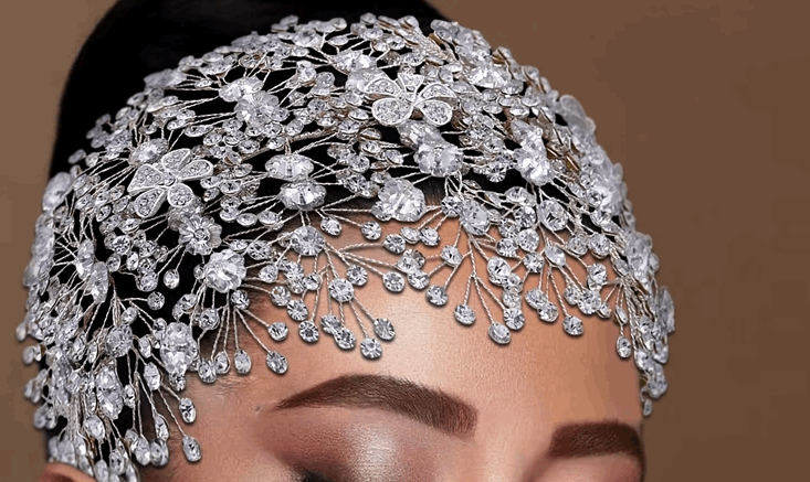 woman wearing a crystal bridal and ballerina headpiece with crystal flowers