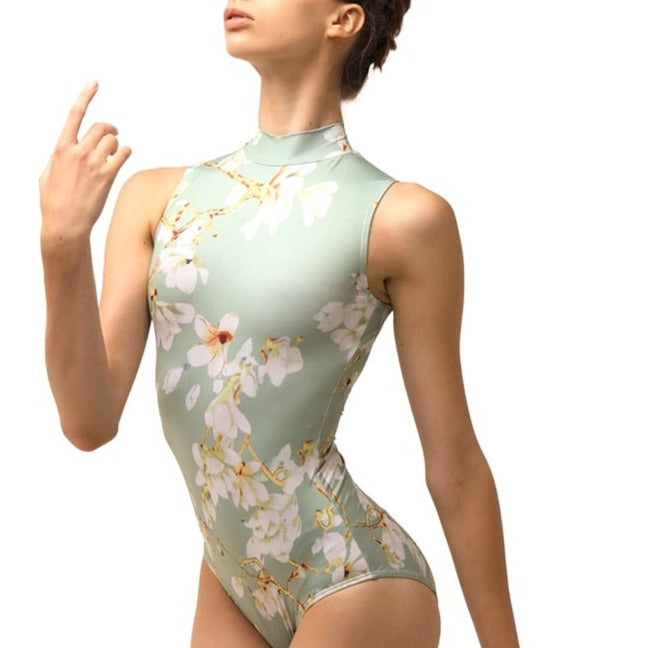 woman wearing afloral short sleeve mock turtleneck leotard. ballet YAGP dance