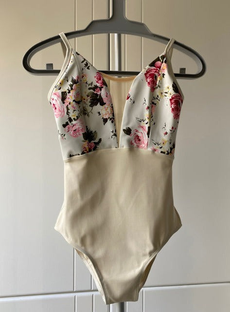front of beige camisole leotard with floral contrast