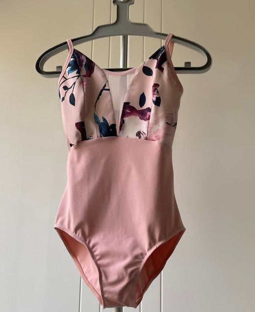 front of pink and floral camisole leotard