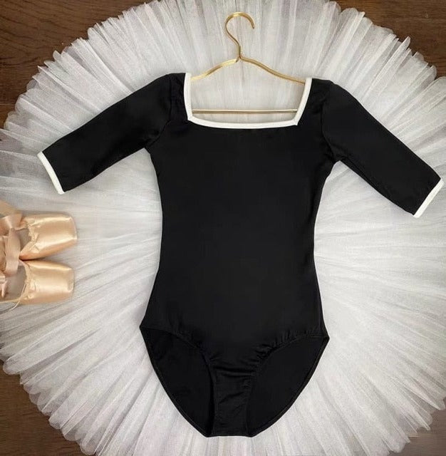 black 3/4 sleeve leotard with white trim 3/4 sleeve leotard with white trim