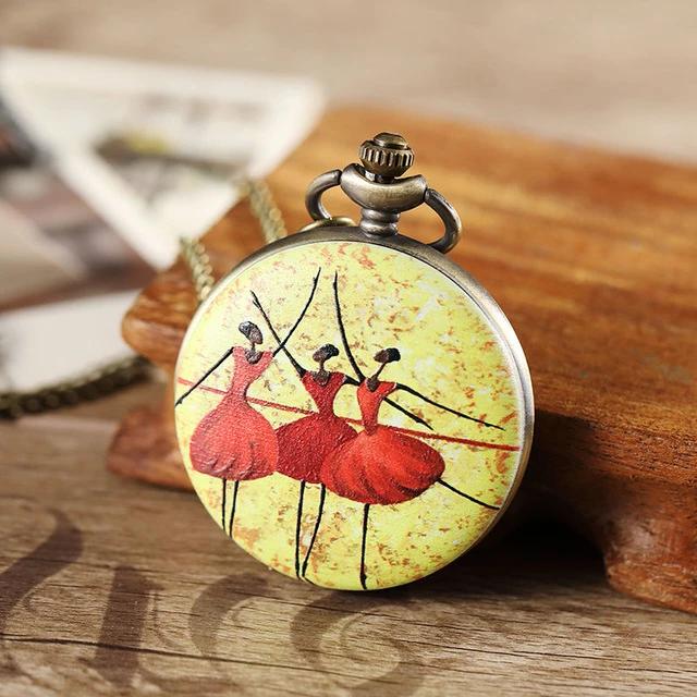 Front of ballerina pocket watch with three black ballerinas wearing red tutus