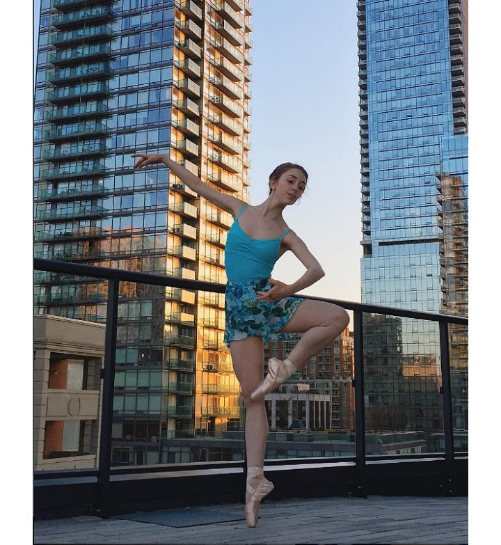 woman wearing blue floral ballet wrap skirt