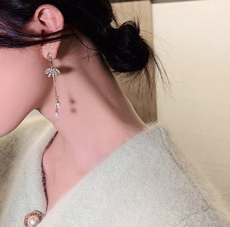 woman wearing Rhinestone and faux pearl ballerina drop earrings