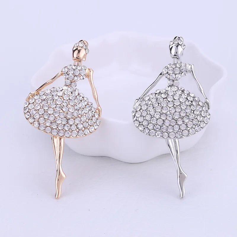 front of two crystal ballerina pins