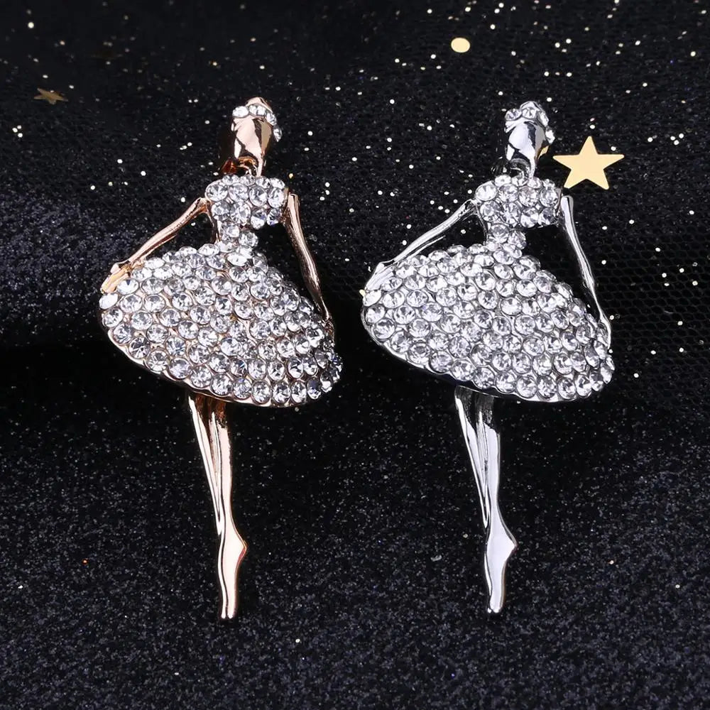 front of two crystal ballerina pins