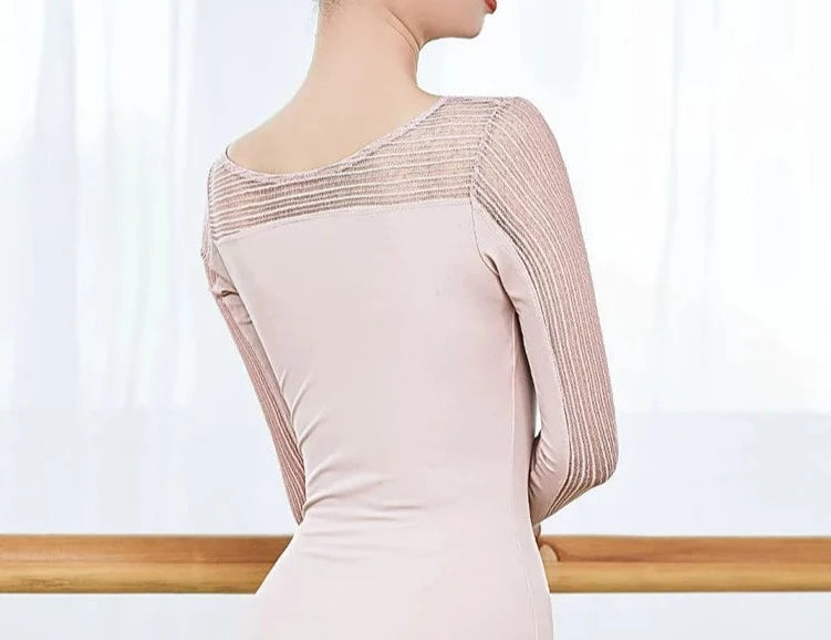 back of woman wearing long sleeve pink leotard