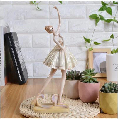 Figura de bailarina de ballet con zapatillas de punta y tutú beige.