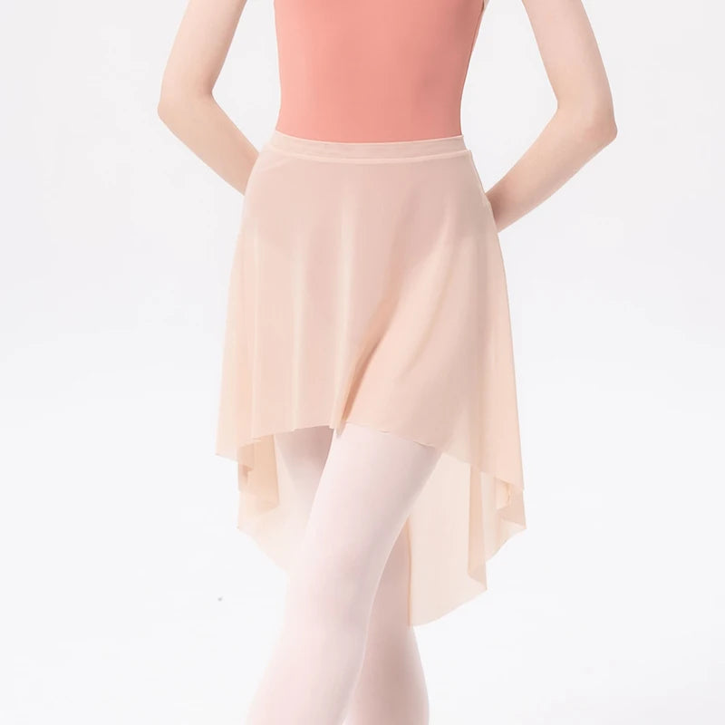 front of woman wearing a beige mesh ballet skirt