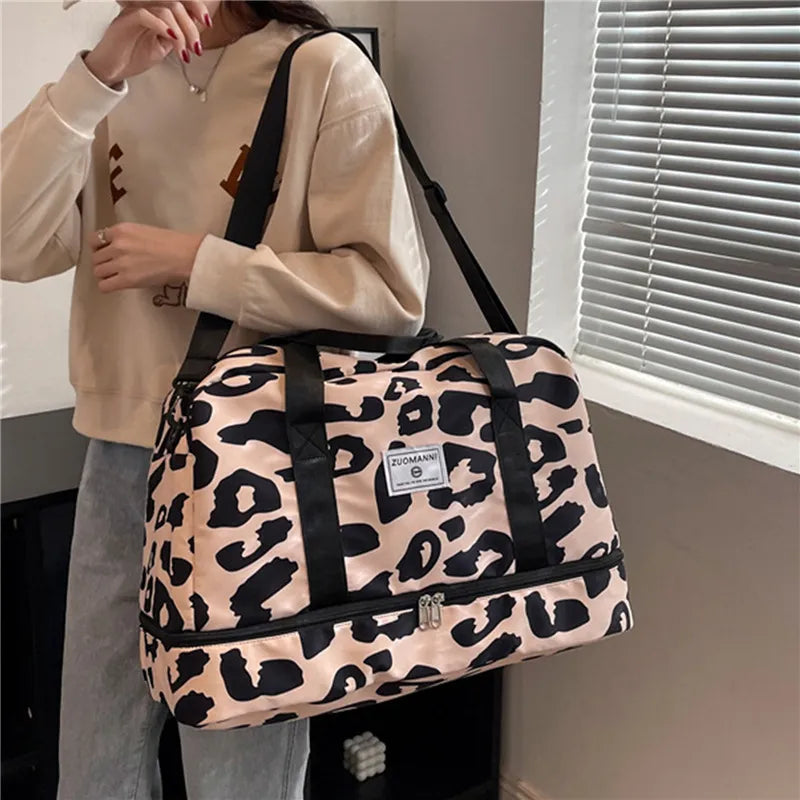 woman carrying pink and black dance bag sports bag