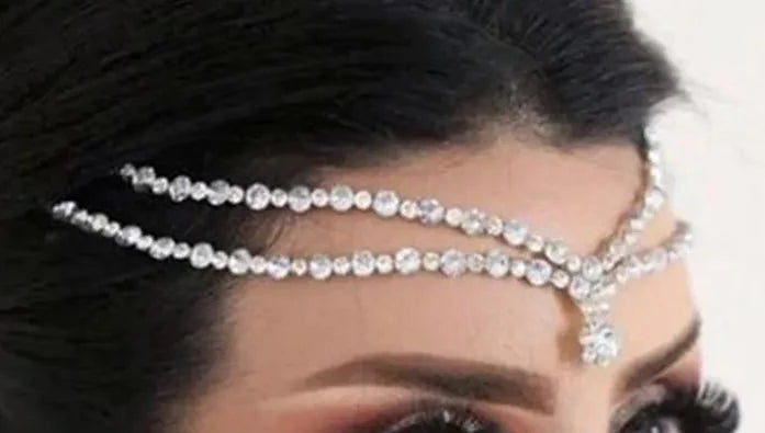 woman wearing crystal forehead chain