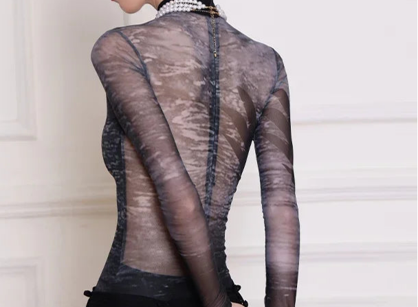 Elegant back view of Mizuki leotard featuring long sleeves and mesh contrast, ideal for ballet and gymnastics.