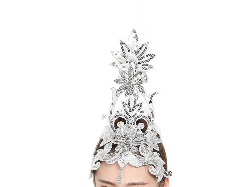 front of woman wearing a silver sequined ballet headpiece