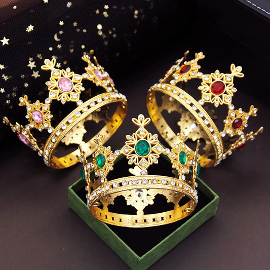 three small gold crowns with faux gems