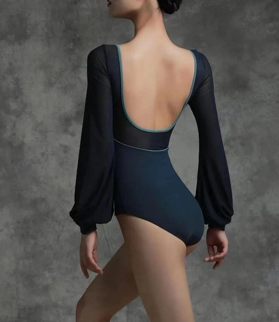 back of woman wearing a long sleeve ballet leotard and bodysuit