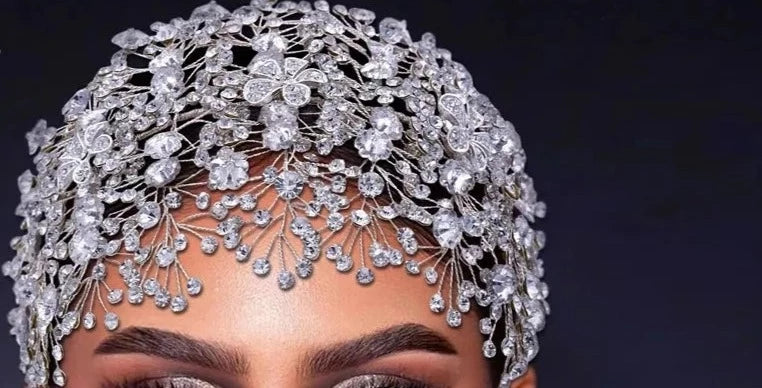 woman wearing a crystal bridal and ballerina headpiece with crystal flowers