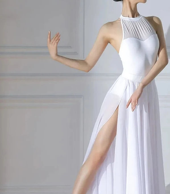 woman wearing white leotard and white ballet skirt