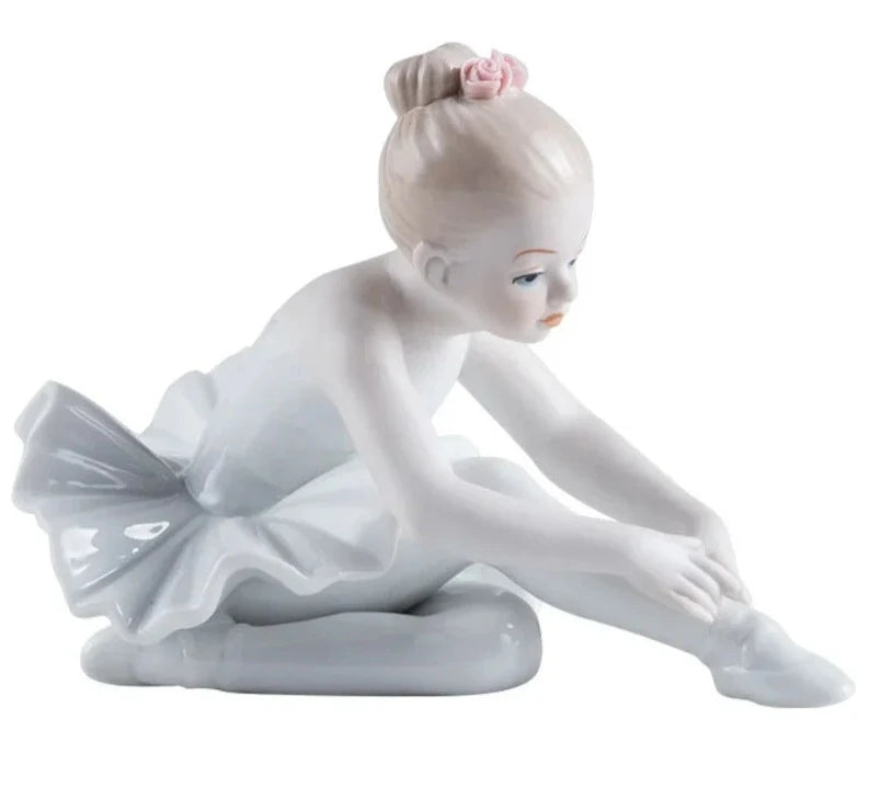 balerina figurine reaching for shoes