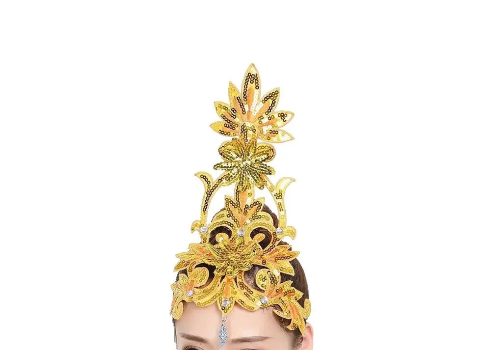 front of woman wearing a yellow sequined ballet headpiece