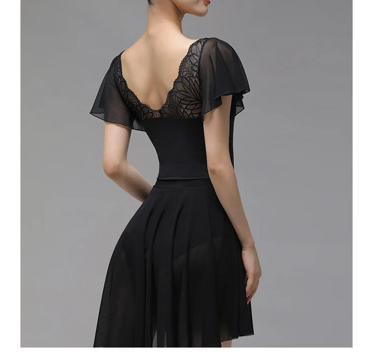 back of woman wearing a black lace leotard with butterfly sleeves
