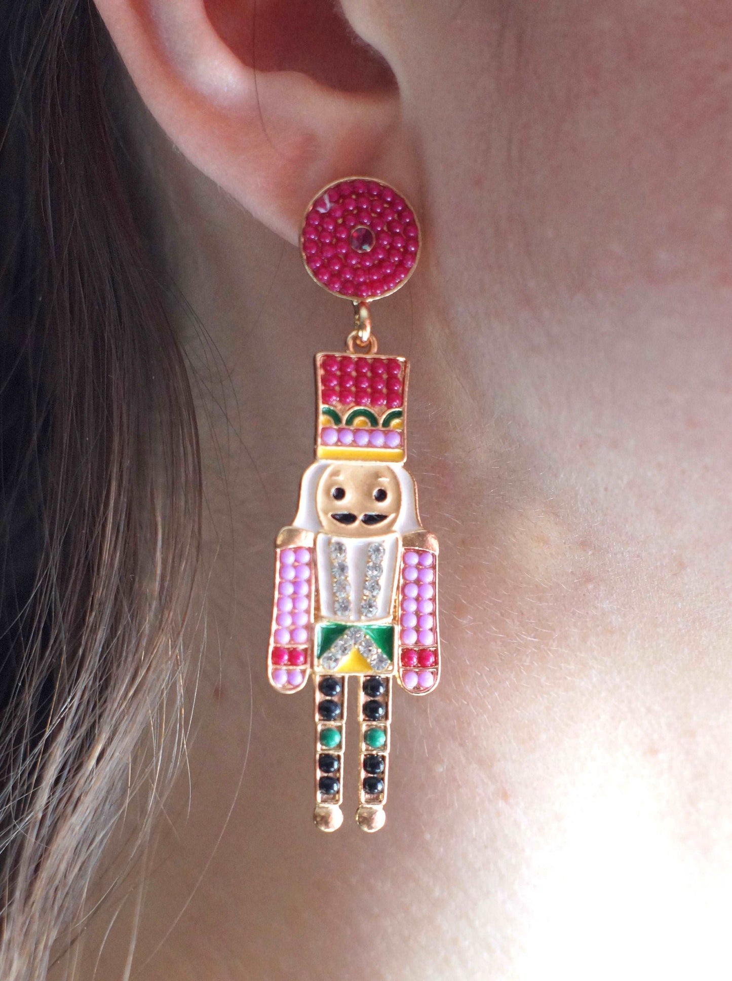 woman wearing nutcracker ballet earrings