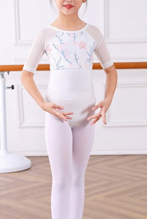 front of girl's white and floral 3/4 sleeve leotard
