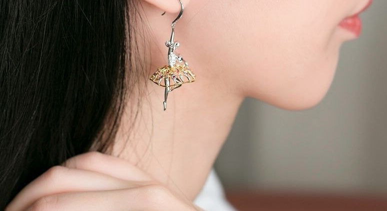 woman wearing silver ballerina earrings with crystals