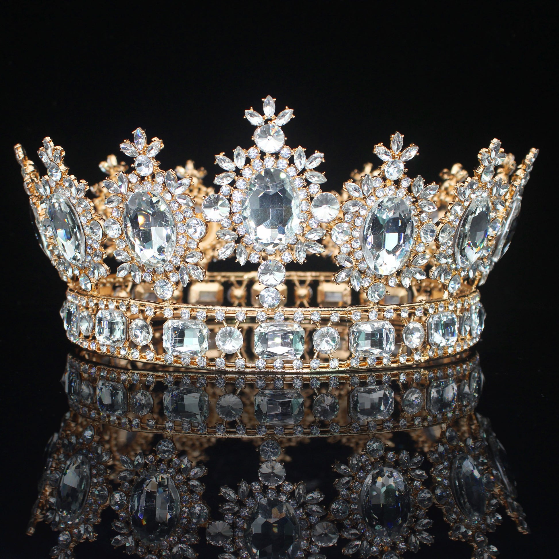 front of clear crystal and gold crown