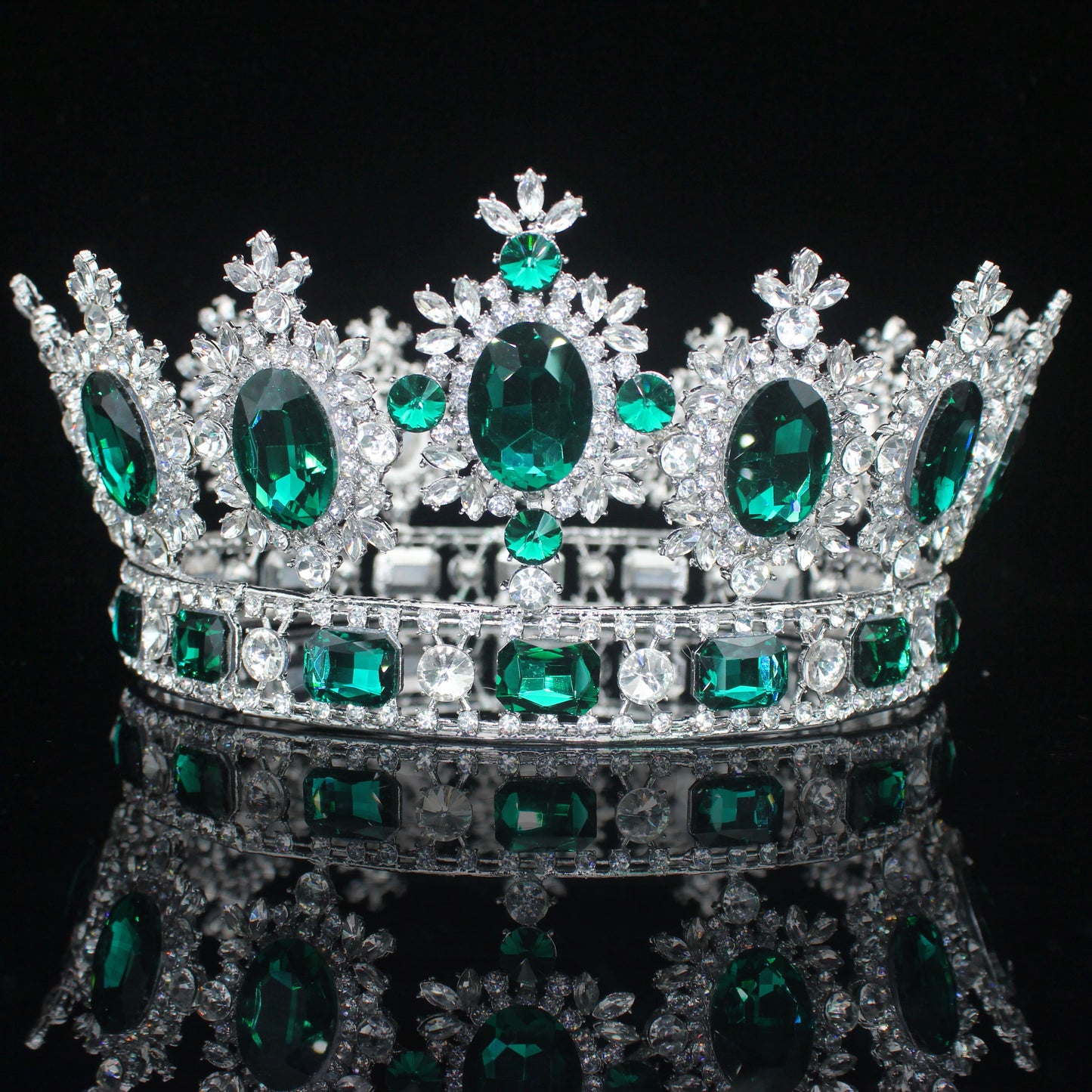 front of green emerald crown. YAGP