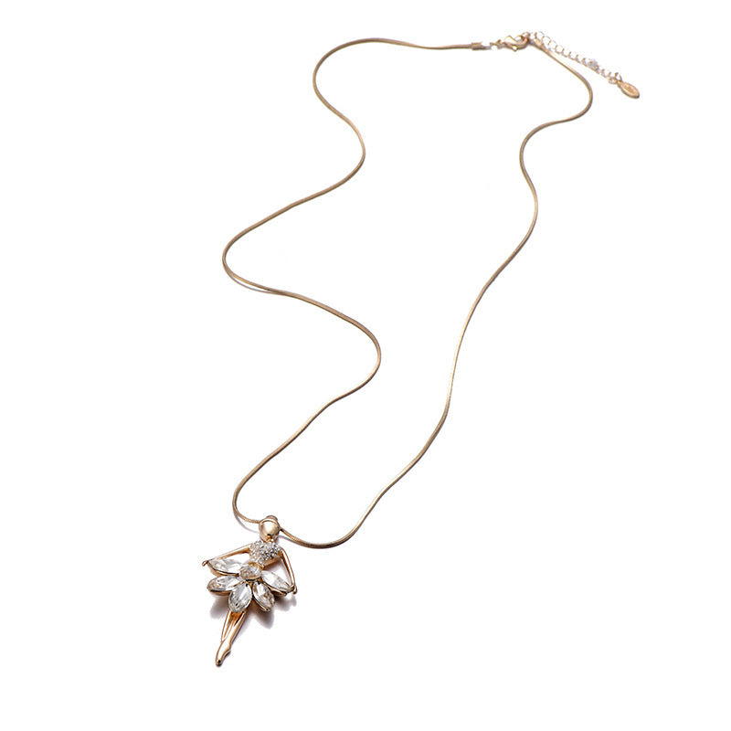 Gold tone ballerina necklace with cubic zirconia