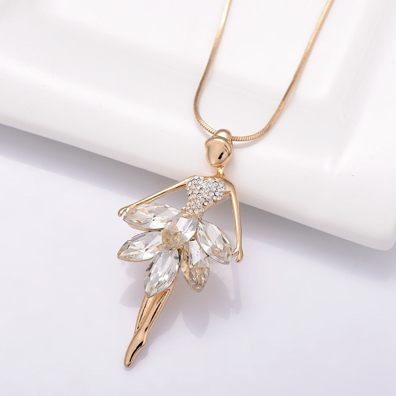 Gold tone ballerina necklace with cubic zirconia