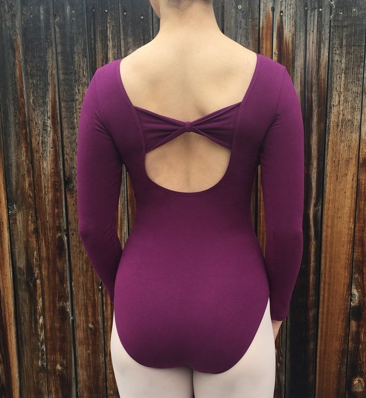 back of long sleeve plum leotard with pinch front and bow back