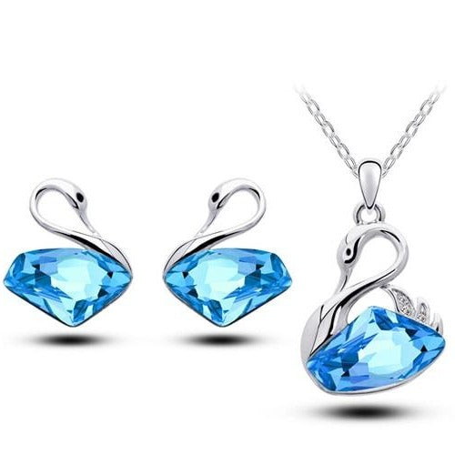 ensemble boucles d'oreilles et collier cygne en cristal bleu