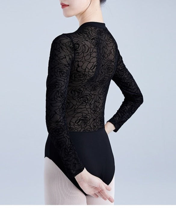 back of woman wearing black long sleeve zipper front leotard with lace back