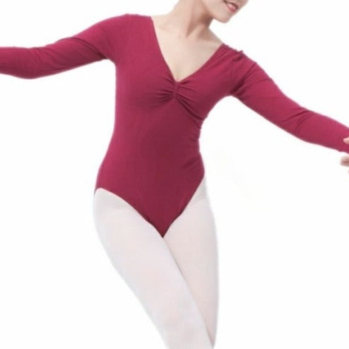 front of lady wearing long sleeve maroon leotard with pinch front