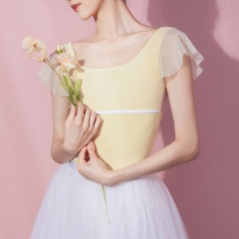 front of yellow leotard with white chiffon sleeves