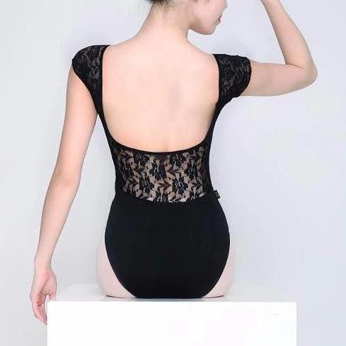 woman wearing black leotard with lace back